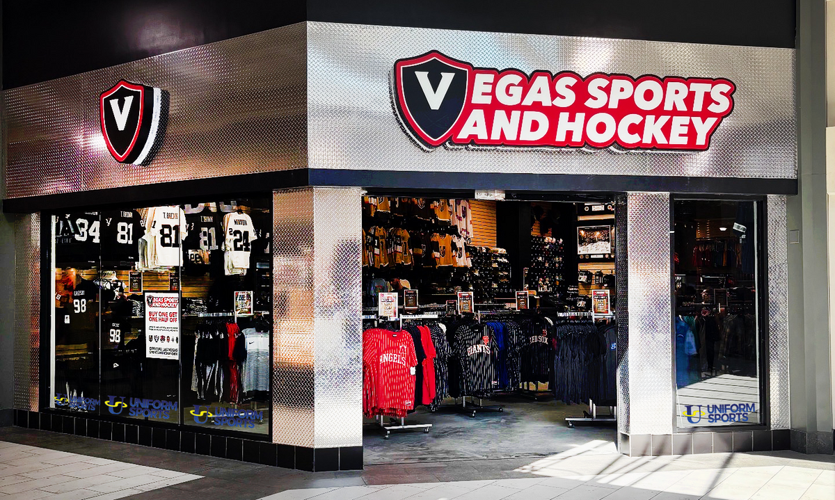 Interior of the Uniform Sport hat shop with shelves of caps